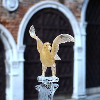 glass bird sculpture with gold leaf detail