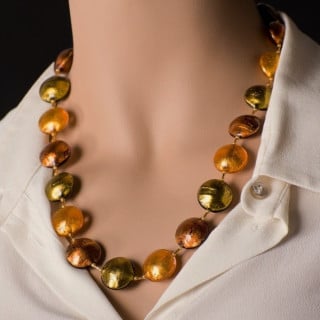 Necklace with amber beads and gold leaf