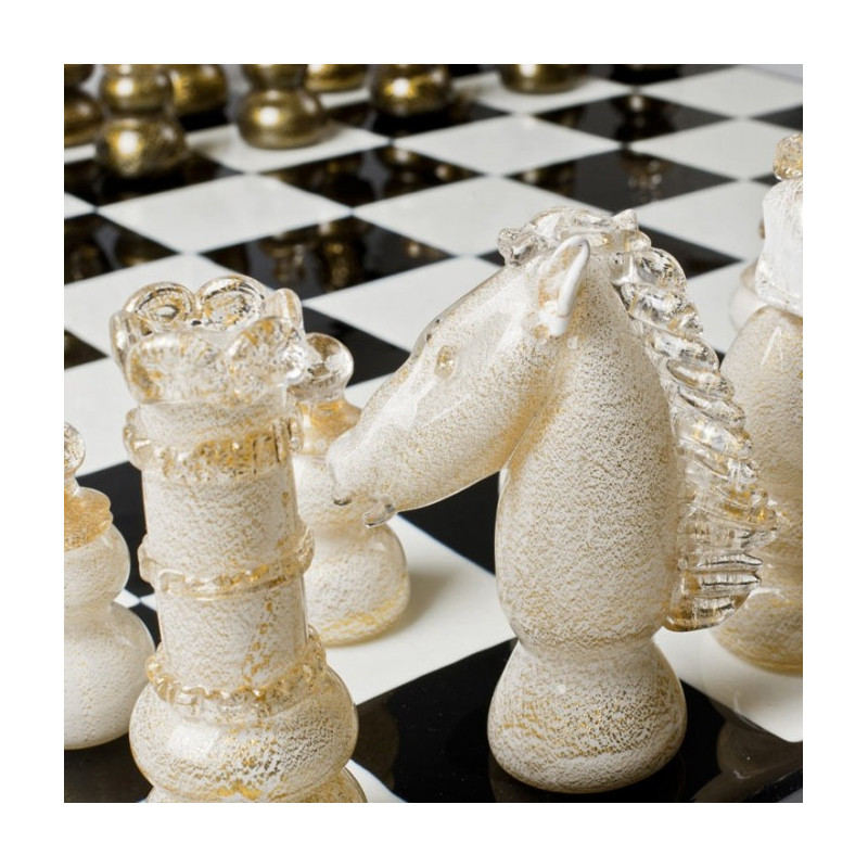 black and white chessboard sculpture with gold details