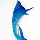 tall fish design sculpture with clear base
