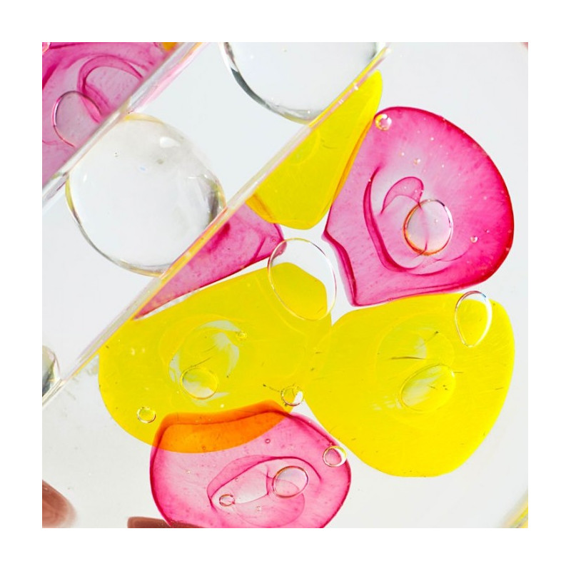 ovoid sculpture with pink and yellow details for home decor