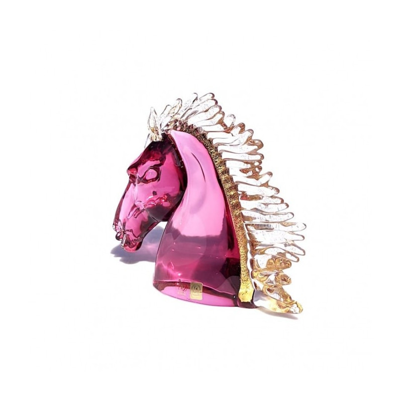 horse sculpture in pink glass with details on gold