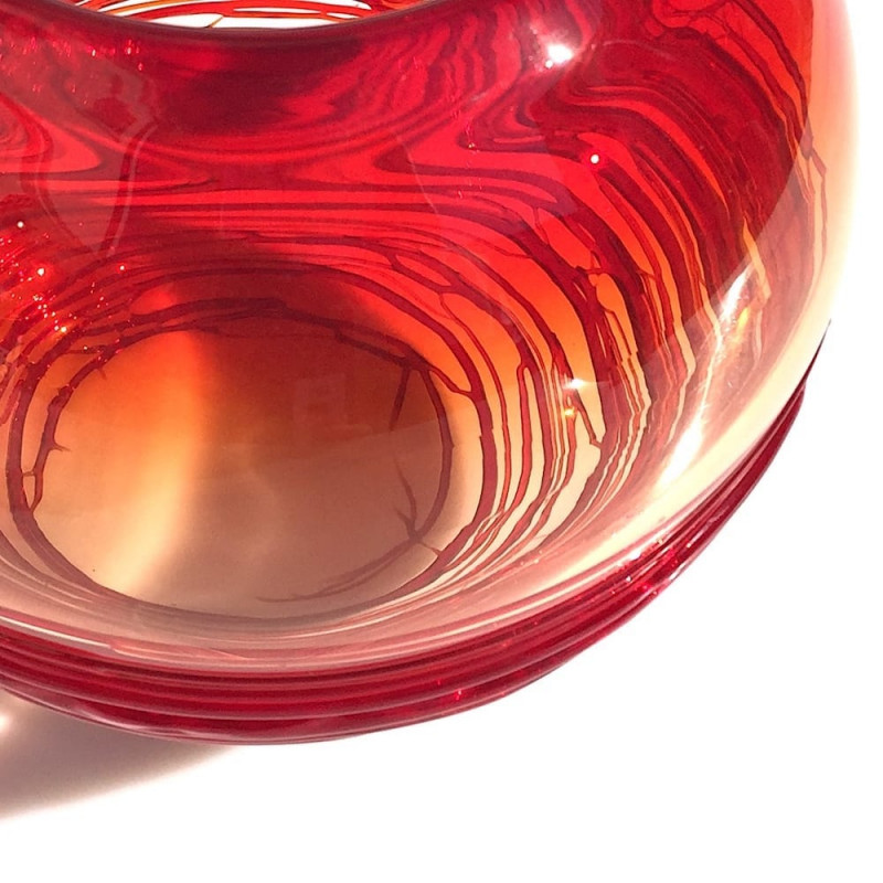 Glass vase with circular red filaments