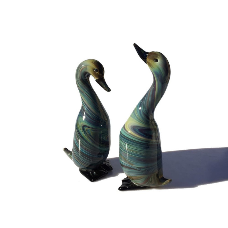 pair of blue and green glass sculptures