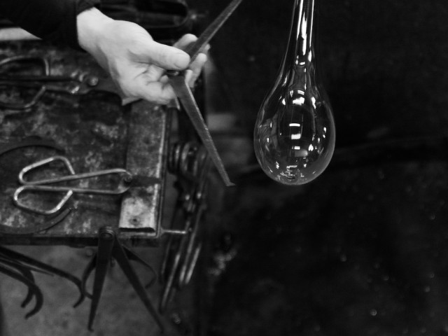 How many Murano glass factories are there in Murano?